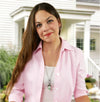 woman in pink wearing her may birth flower necklace